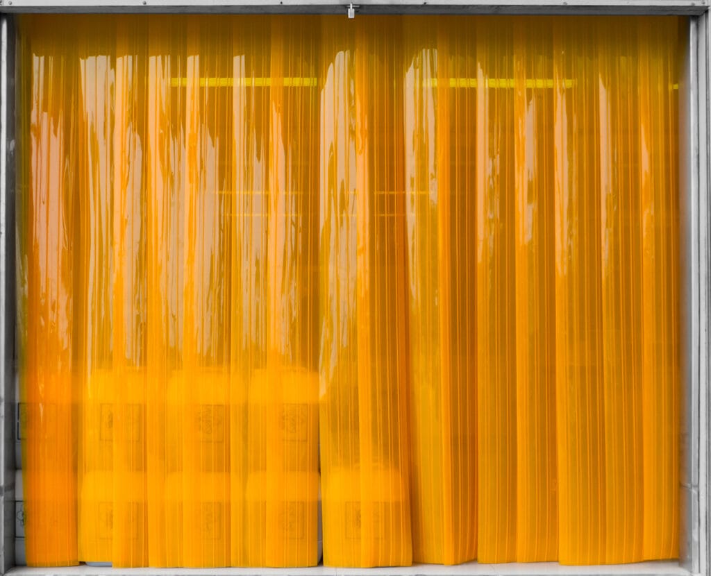 PVC strip curtains: Durable and flexible solution for controlling temperature, noise, and air flow in commercial and industrial spaces while maintaining easy access.