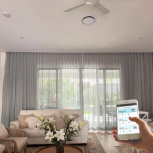 How Motorized Curtain Enhance Smart Home: Modern living room with motorized curtains in a smart home setup.