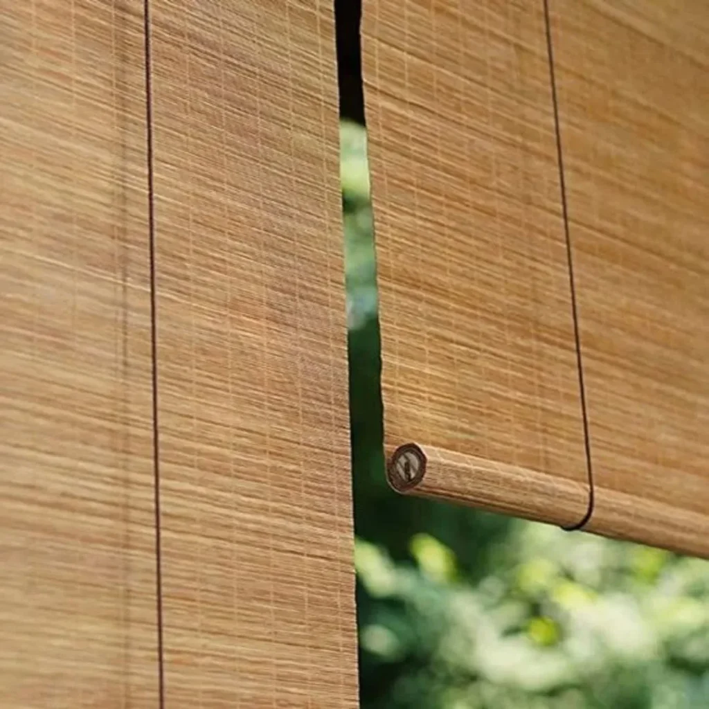 Person cleaning modern window blinds demonstrating how to maintain and clean your blinds for lasting beauty and shine.