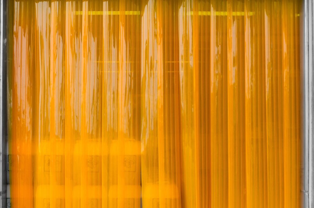 PVC strip curtains: Durable and flexible solution for controlling temperature, noise, and air flow in commercial and industrial spaces while maintaining easy access.